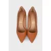 Brown leather pumps