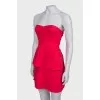 Red dress with frills, with a tag