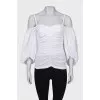 Draped blouse with puffed sleeves