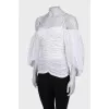 Draped blouse with puffed sleeves