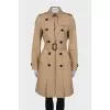 Beige trench coat with belt