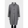 Wool coat with decorated press-studs