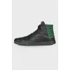 Men's black sneakers with green inserts