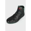 Men's black sneakers with green inserts