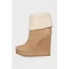 Beige suede wedge boots