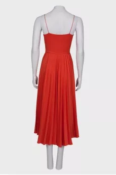 Orange dress with pleated skirt