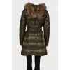 Khaki elongated down jacket under the belt with a tag