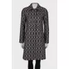 Coat in geometric black and white print
