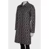 Coat in geometric black and white print