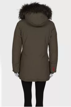 Green parka with fur on the hood with a tag
