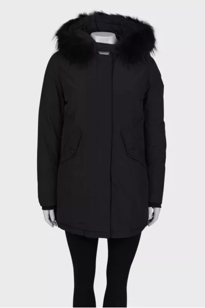 Black parka with fur on the hood with a tag