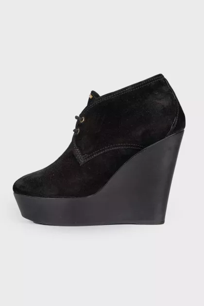 Black high wedge ankle boots