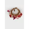 Golden bracelet with large rhinestones