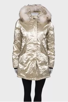 Golden parka with fur on the hood with a tag
