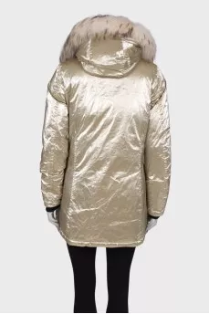 Golden parka with fur on the hood with a tag