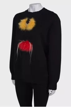 Black sweatshirt with fur inserts