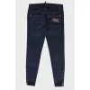 Jeans with rhinestone brooch