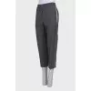 Gray trousers with stripes