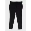 Black trousers with metal belt