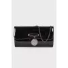 Lacquered clutch bag with chain