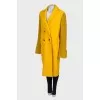 Yellow coat with knitted sleeves