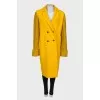 Yellow coat with knitted sleeves