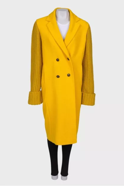 Yellow coat with knitted sleeves