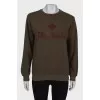 Dark green sweatshirt with brand logo