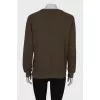 Dark green sweatshirt with brand logo