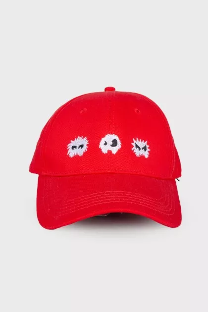 Red cap with embroidery, with a tag