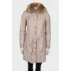Coat with natural fur on the hood