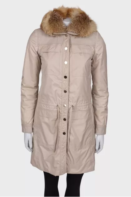 Coat with natural fur on the hood