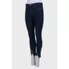 Jeans with slit and lace front