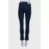 Jeans with slit and lace front