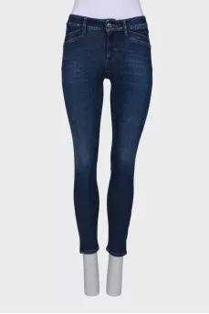 Navy blue jeans with a zip at the bottom