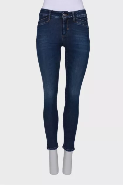Navy blue jeans with a zip at the bottom