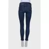 Navy blue jeans with a zip at the bottom