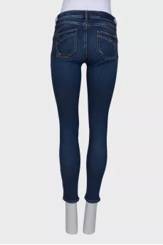 Navy blue jeans with a zip at the bottom