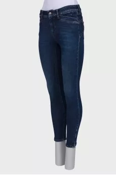 Navy blue jeans with a zip at the bottom