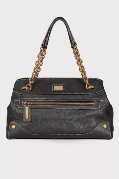 Black leather bag with golden hardware