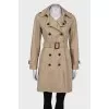 Beige belted trench coat