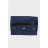 Dark blue clutch bag with tag