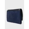 Dark blue clutch bag with tag