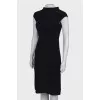 Black dress close-fitting in the waist