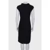 Black dress close-fitting in the waist