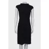 Black dress close-fitting in the waist