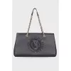 Black leather bag with brand logo