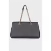 Black leather bag with brand logo