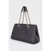 Black leather bag with brand logo