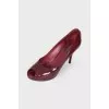 Lacquer burgundy shoes with a lock